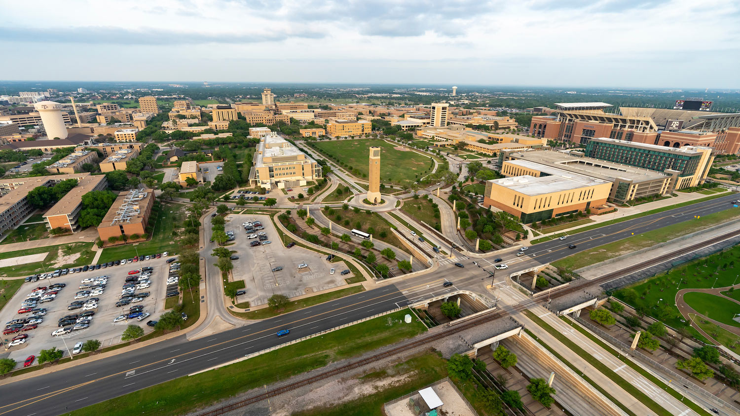 An aerial view of the Texas A&M University campus, focused on the clock tower