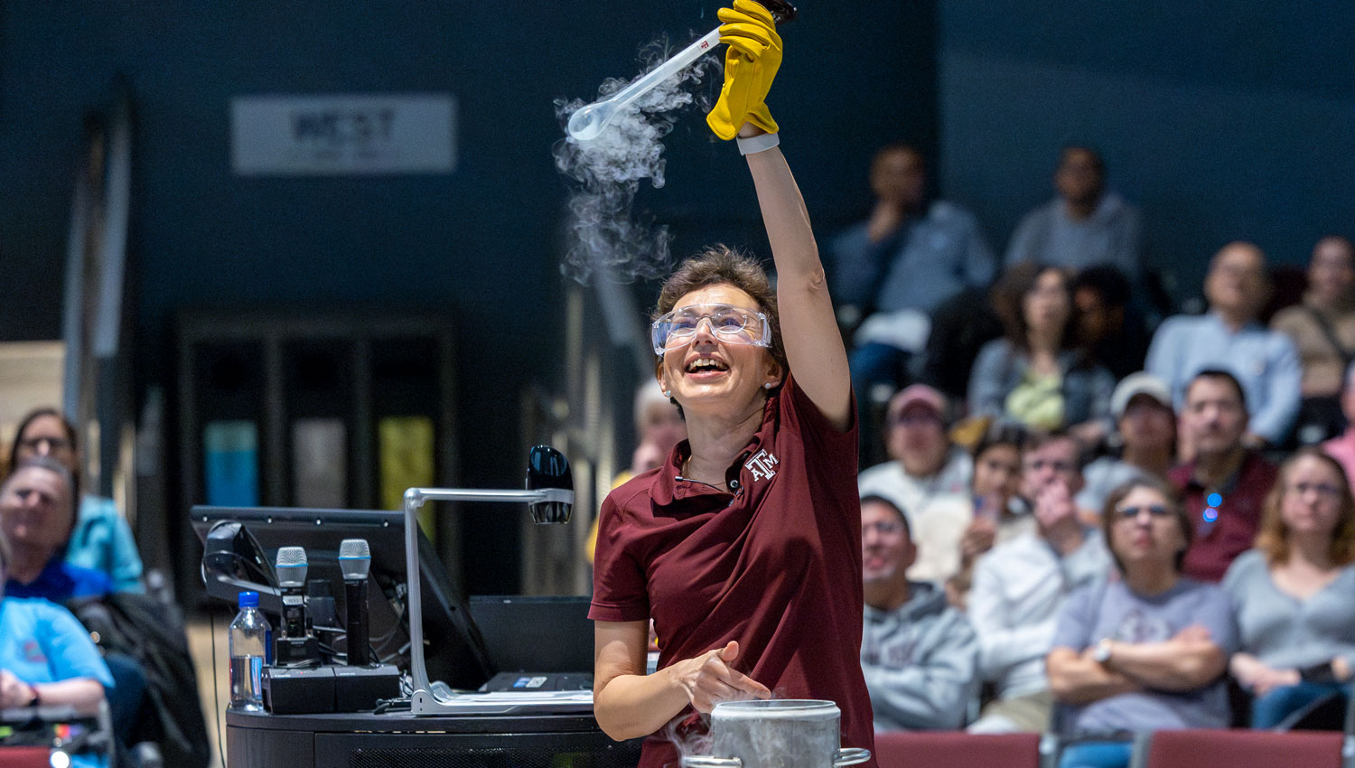 Dr Tatiana Erukhimova a physics instructor at Aggieland Saturday showing a physics experiment